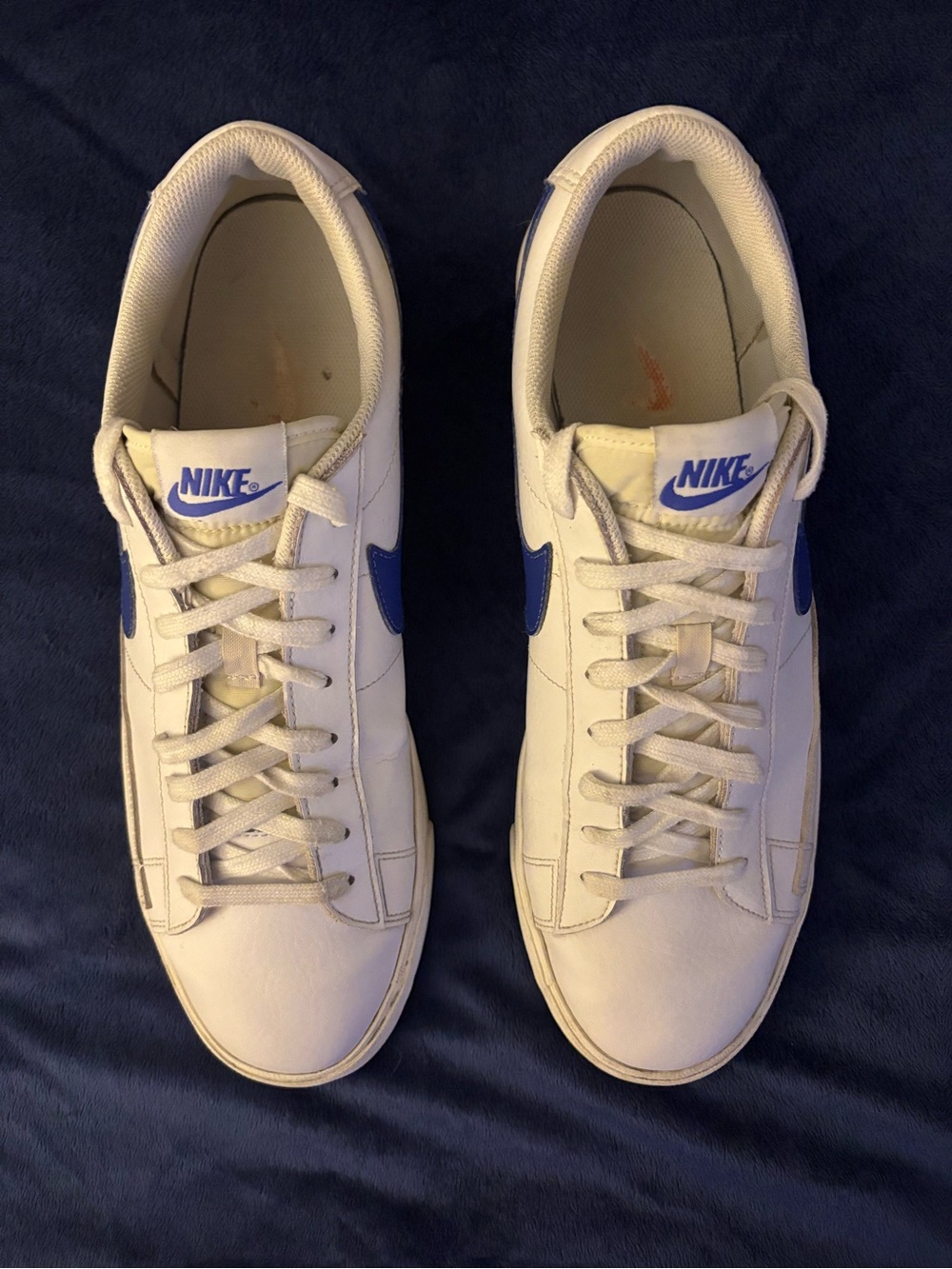Nike Blazer Low Leather Astronomy Blue White Low-Top Sneakers with Blue Swoosh.